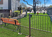 Thumbnail 12 of 30 - Dog park with secure fencing and open play area at Reserve on Abrams Dallas