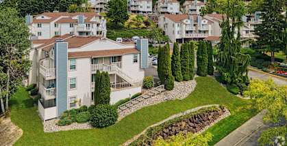 A residential area with houses and greenery.