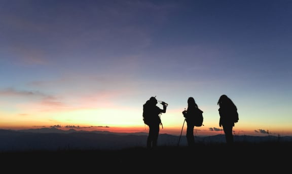Silhouettes-of-Group-Hikers-People-with-Backpacks-Enjoying-Sunset at Lakecrest Apartments, PRG Real Estate Management, South Carolina, 29615