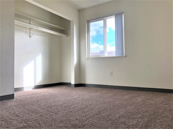 Carpeted Bedroom at Grand Manor, Grand Junction, Colorado