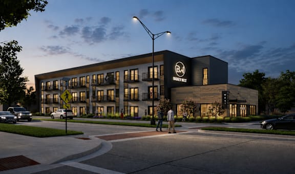 A modern building with a black and white logo on the front.