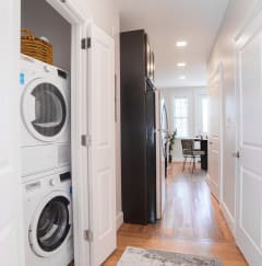a small laundry room with a washing machine and a dryer