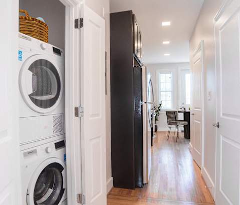 a small laundry room with a washing machine and a dryer