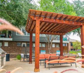 our apartments have a large swimming pool with chairs and umbrellas