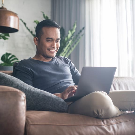 Photo of person working on laptop
