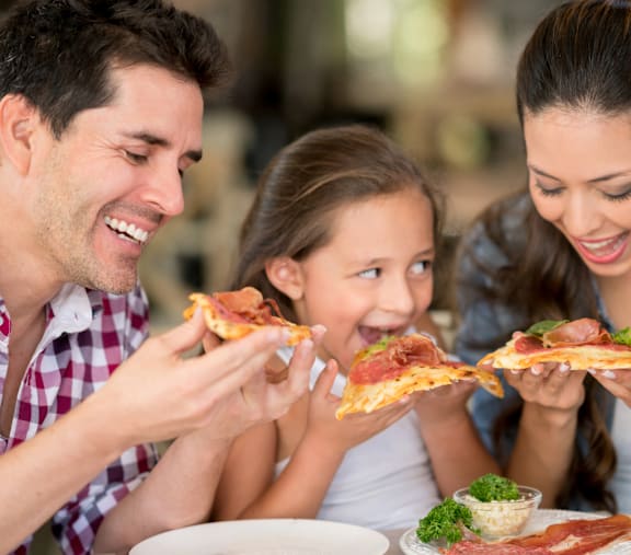 A family enjoying a meal together at a restaurant.