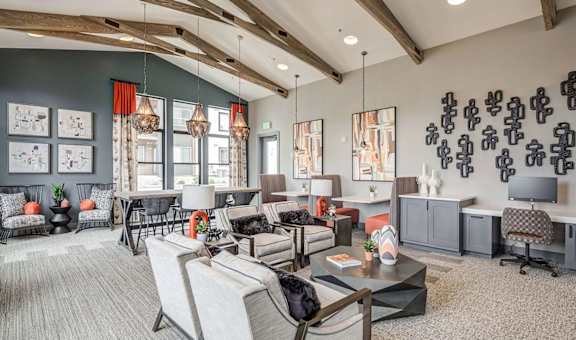 a living room with couches and chairs and a table