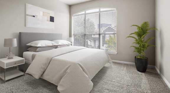 A bedroom with a large bed, a nightstand with a lamp, a potted plant, and a framed artwork on the wall.