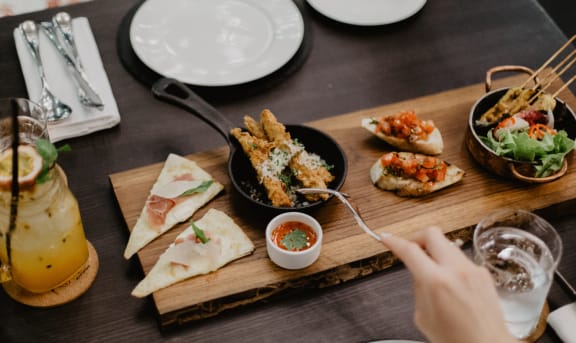 a plate of food on a wooden table