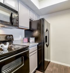 Fully Equipped Eat-In Kitchen at Trinity Village Apartments, Texas