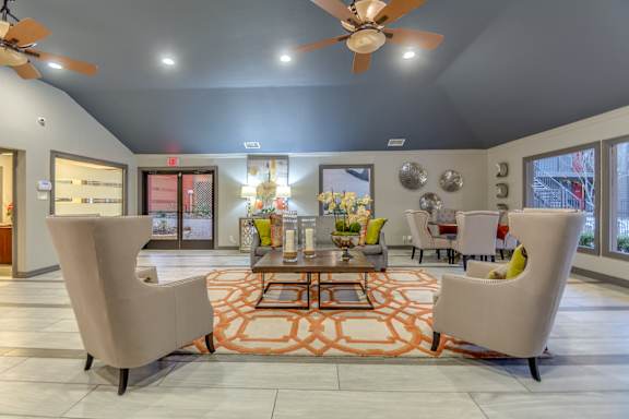 Clubhouse lobby with seating areas and modern decor at The Colony Apartments, Universal City, 78148