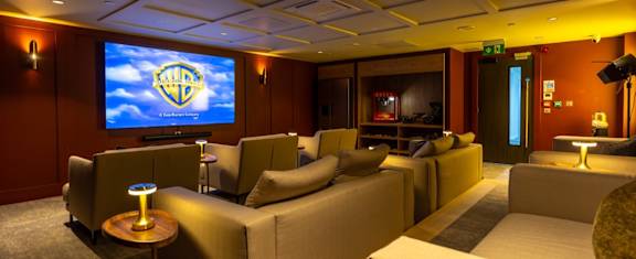 the lobby of a building with a reception desk and a door