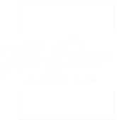 A white logo with the text  at The Dean at Creekview Apartments, Newark, Delaware