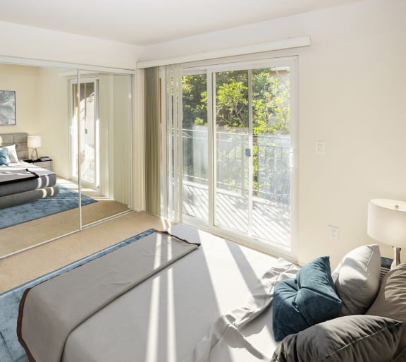 a bedroom with a bed and a mirror at Dronfield Astoria Apartments, Sylmar, California, 91342