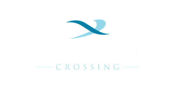 A logo with the text "Twin Creeks Crossing" and a stylized bird.