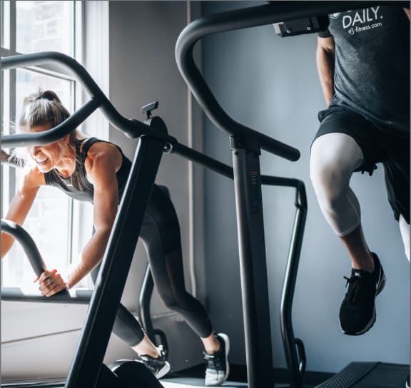 Man and Woman Working Out at Fitness Center