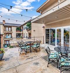 A patio with a table and chairs is shown.