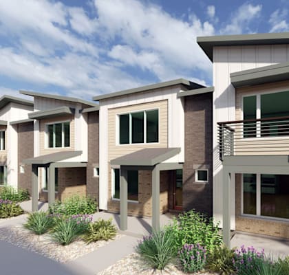 A row of modern houses with a driveway in between.