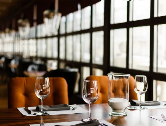 a table with wine glasses in a restaurant