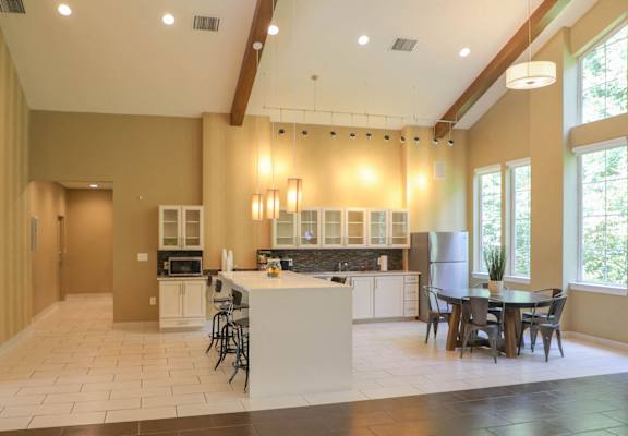 a large kitchen with a dining area and a table at Cascades Overlook Apts., Owings Mills, 21117