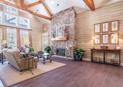 a living room with a fireplace and a large window