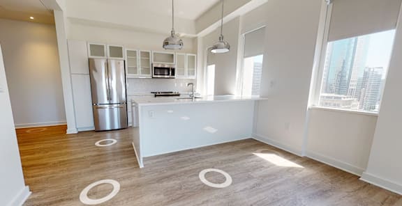a kitchen with stainless steel appliances and a large window, Opens in new tab