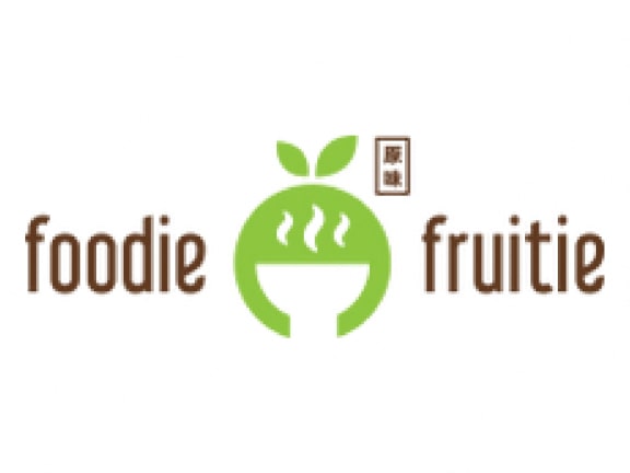 the logo for foodie fruit with a green apple next to a bowl of food