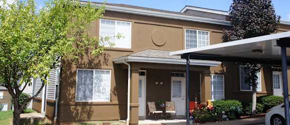 a brown building with a crescent moon painted on the side of it
