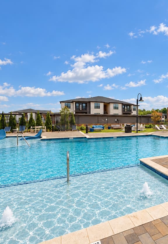 our apartments offer a swimming pool with lounge chairs and umbrellas