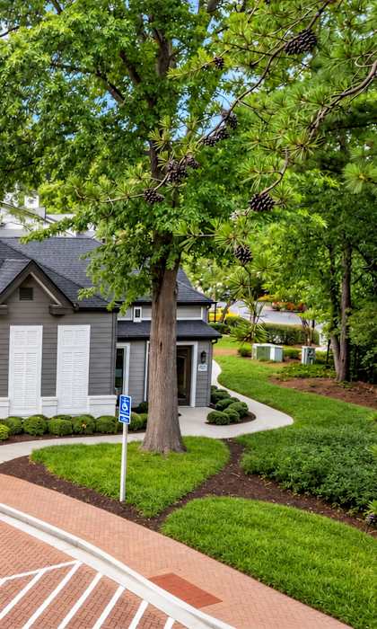 A large house with a driveway in front of it.