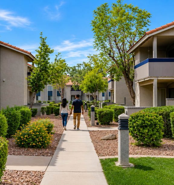 A row of houses with a clear blue sky above them.