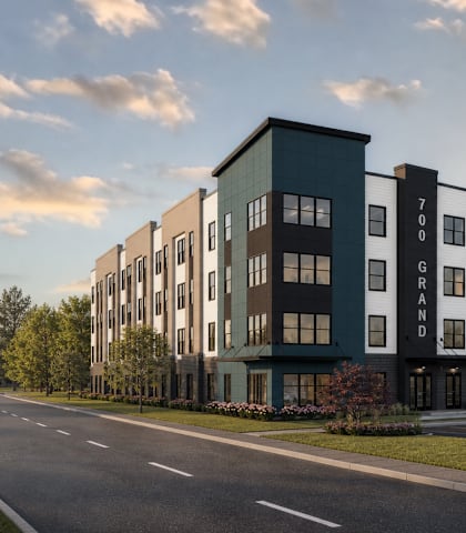 A modern apartment building with the number 700 on the side.