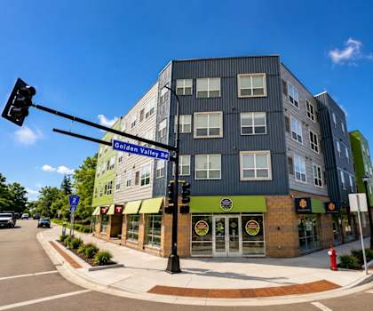 A street view of a building with the sign "Golden Valley" on it.