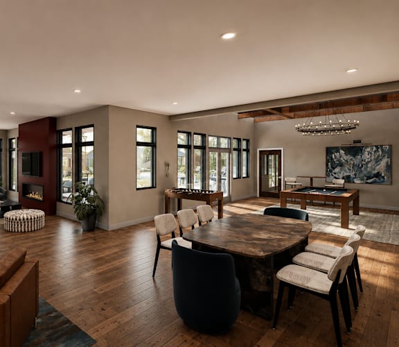 A modern living room with a large wooden table and chairs.