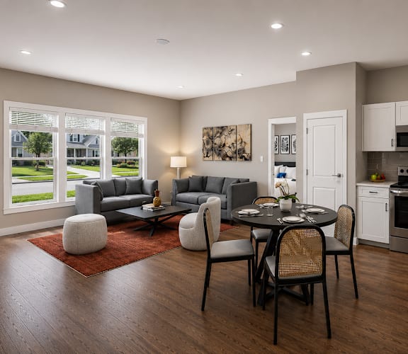 A modern kitchen with a dining table set for four.