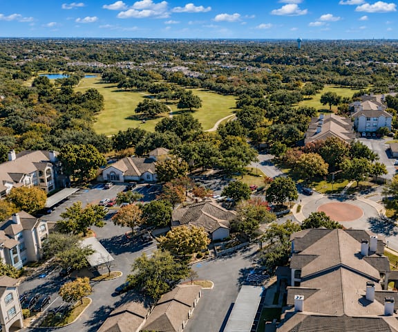 A bird's eye view of a residential area with houses and trees.