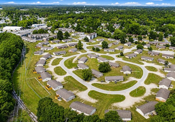 A bird's eye view of a residential area with houses arranged in a circular pattern.