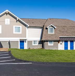 Apartments in Antioch, TN 37013 for Rent – Hickory Lake - A building with a grey roof and blue doors.