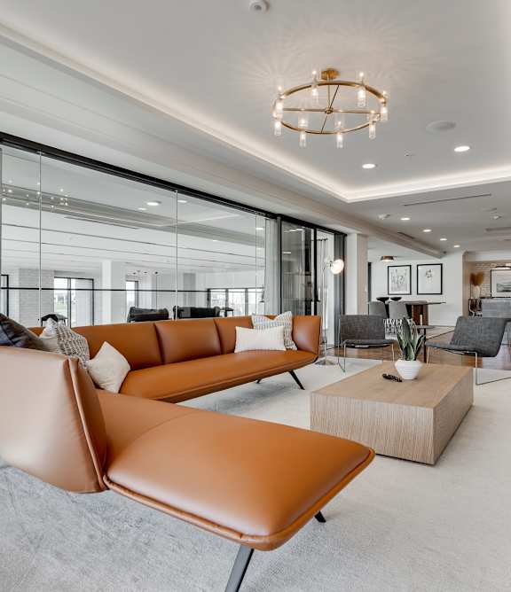 a living room filled with furniture and a large fireplace