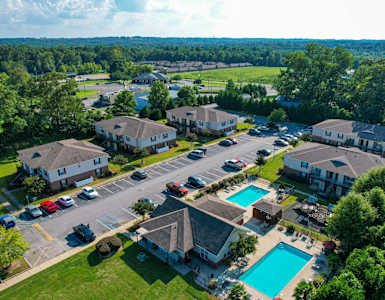 a aerial view of a neighborhood with houses and swimming pools