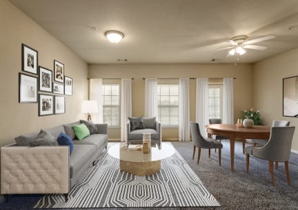a living room and dining room with a couch and a table