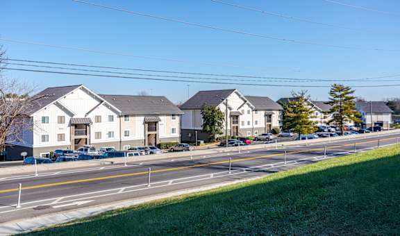 Pet-Friendly Apartments in Antioch, TN– Hickory Lake – A row of houses with cars parked in front.