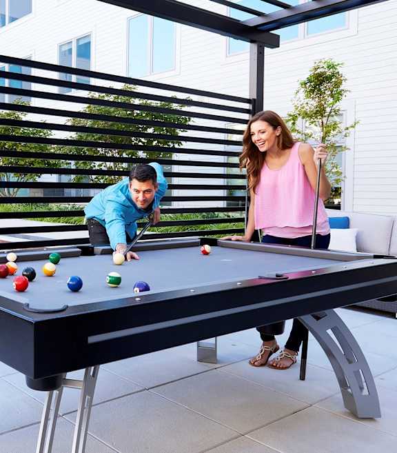 residents playing pool at AVE Florham Park