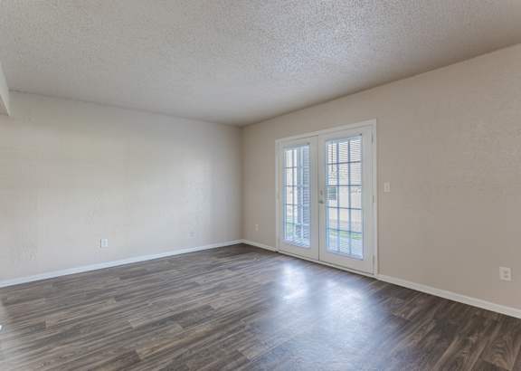 a living room with couches and chairs and a table