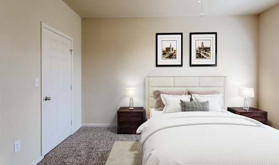 a bedroom with a large bed and two night stands
