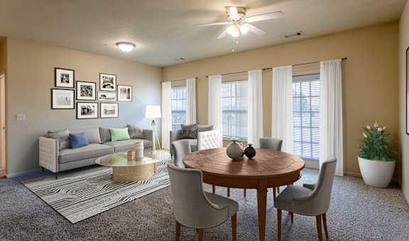a living room with a table and chairs and a couch