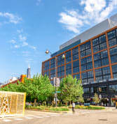 a person standing in front of a large building