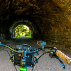 a motorcycle in front of a tunnel