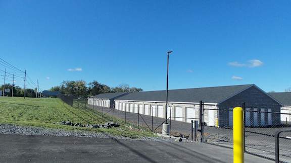 a large building with a chain link fence in front of it