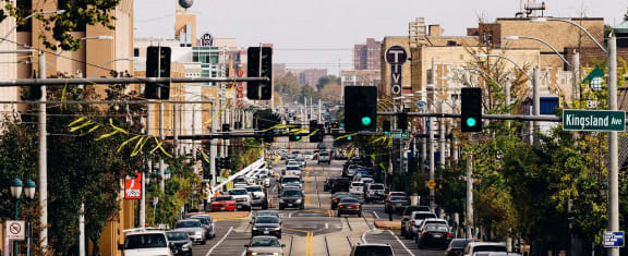 a busy city street with many cars and traffic lights